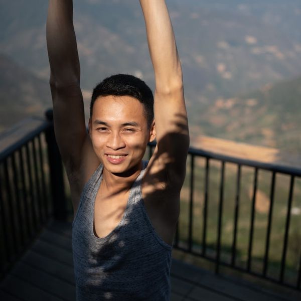 Person feeling energetic and stretching towards the sun.